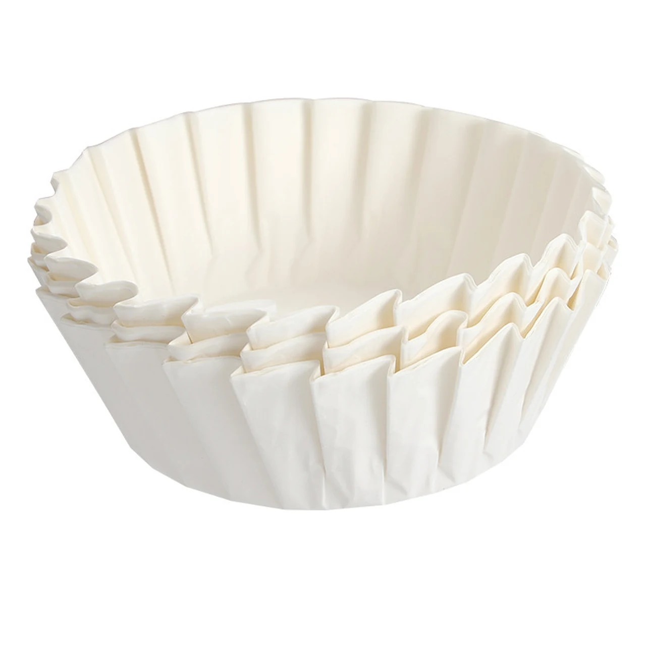 Stack of white pleated Basque cake paper liners on a white background.