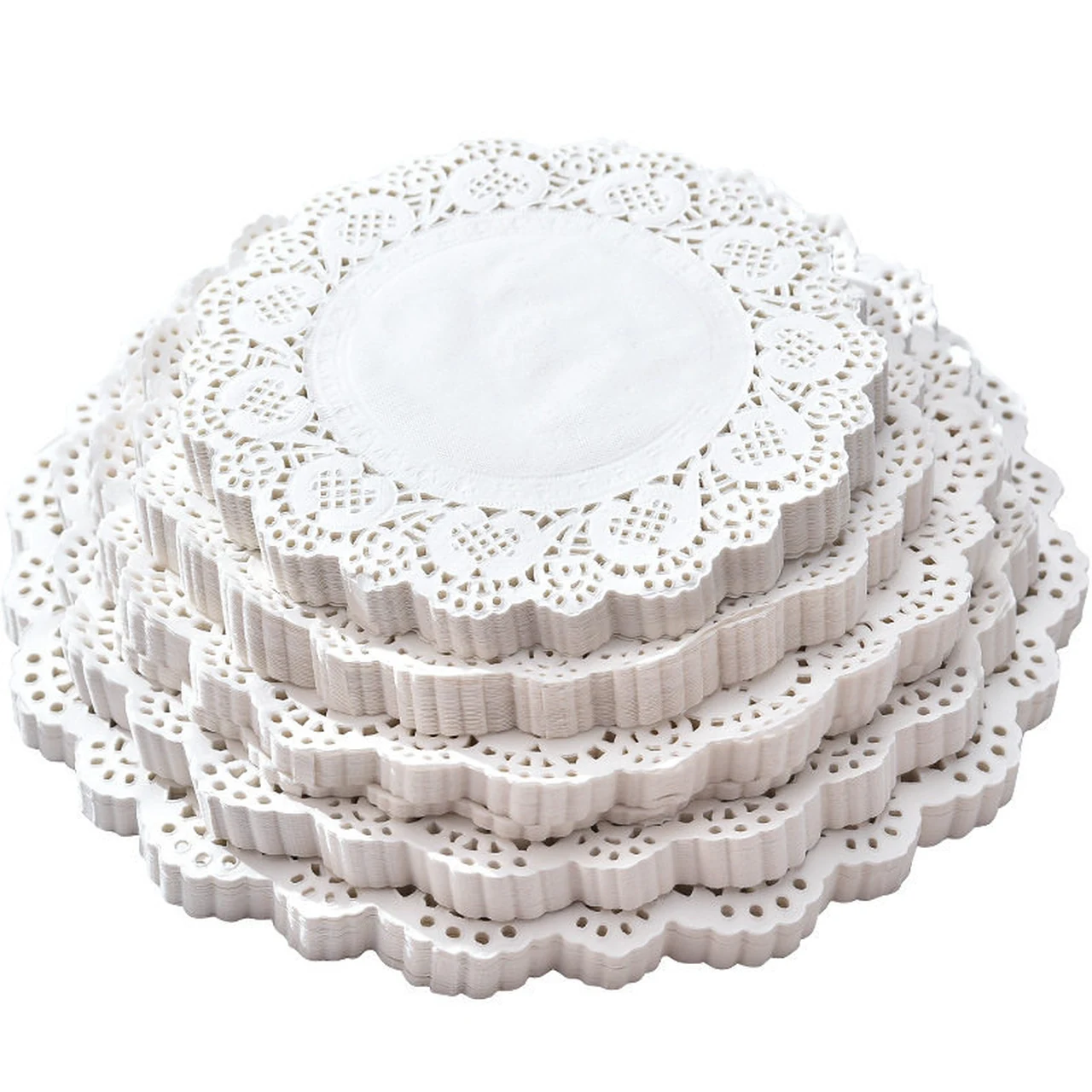 Stacks of white round lace paper doilies in several diameters.