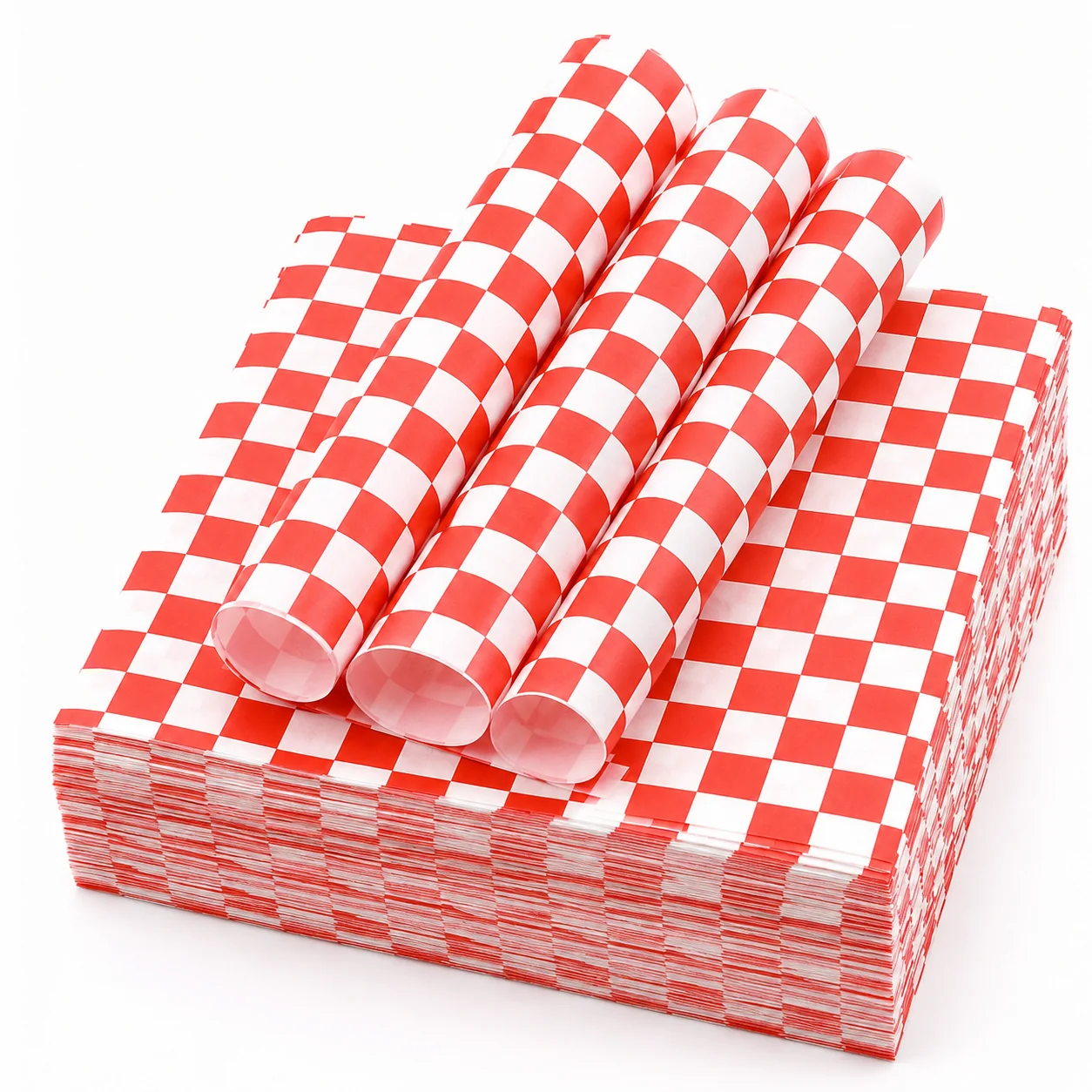 Stack of red and white checked food wrapping paper with several sheets rolled back